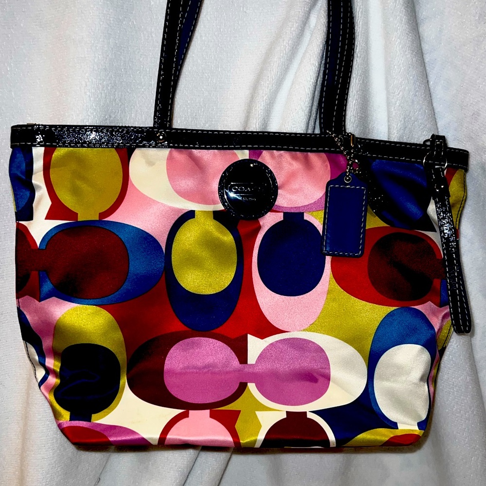 Authentic Coach multi colored tote purse. Dark blue inside and on handles.